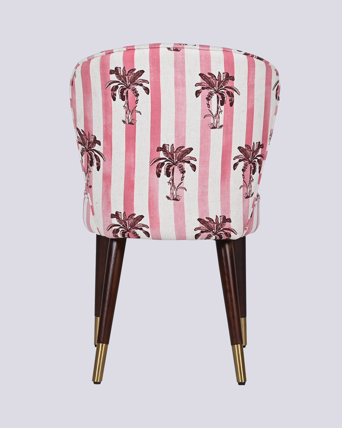Back of a pink striped Ripple chair covered in maroon palm print.