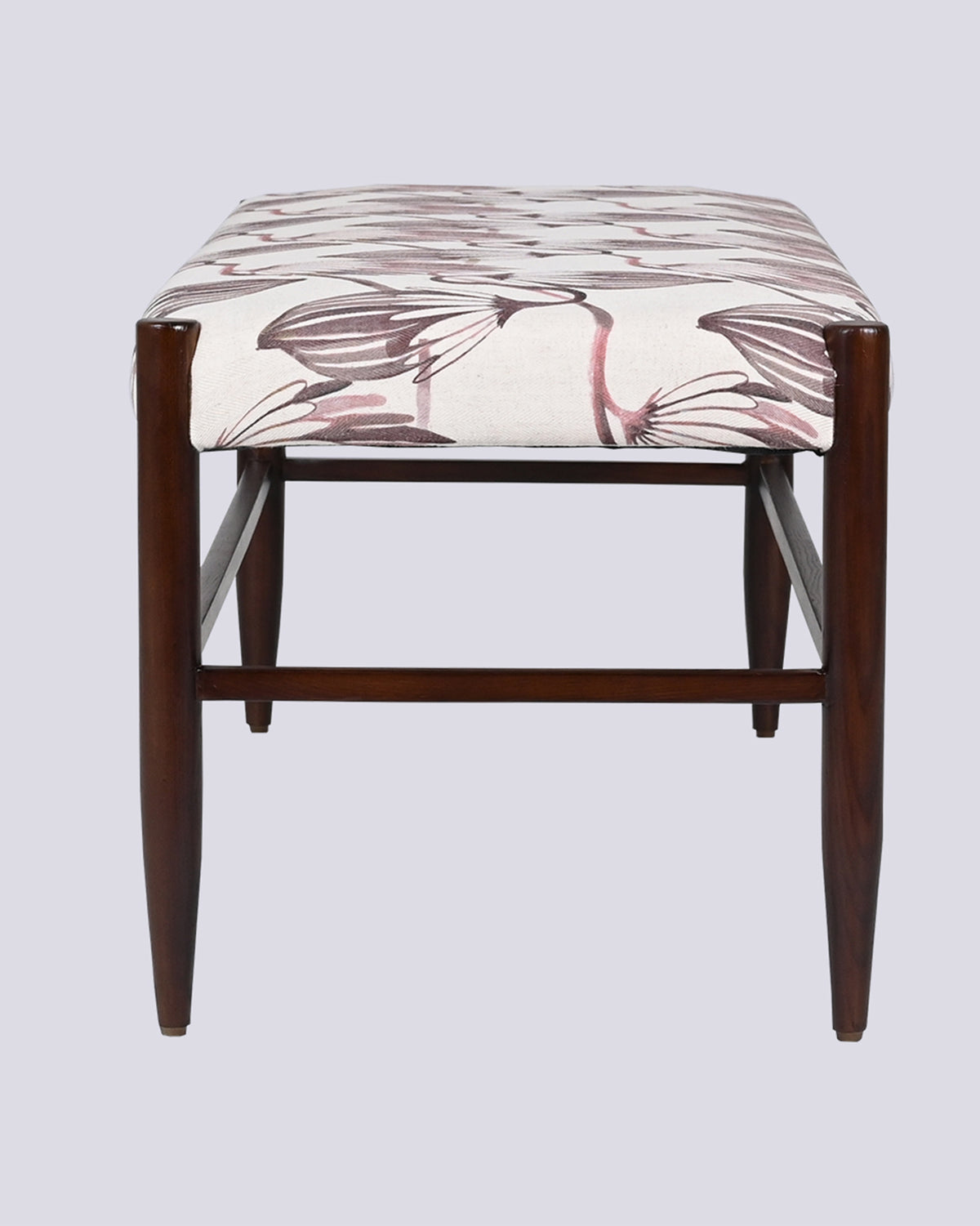Side view of the Moor Bench showing its tapered dark wooden legs.