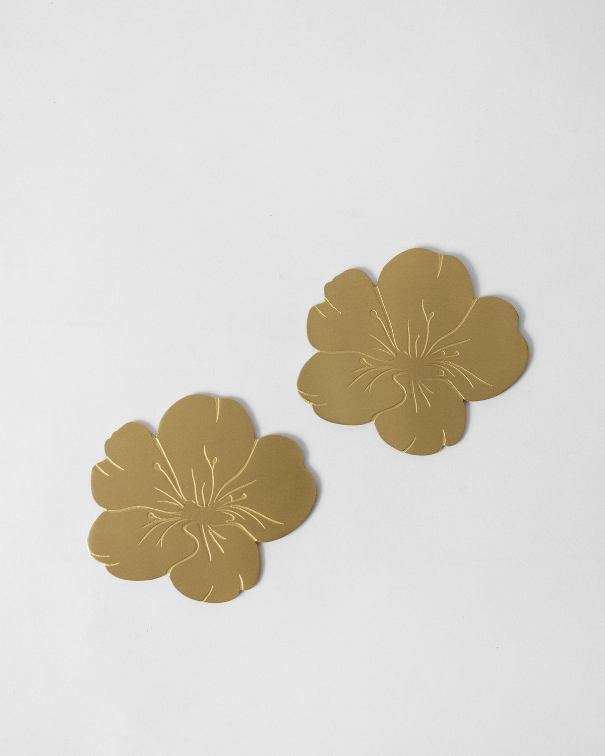 Pair of Almond Blossom Coasters laid flat, showing their embossed petals.