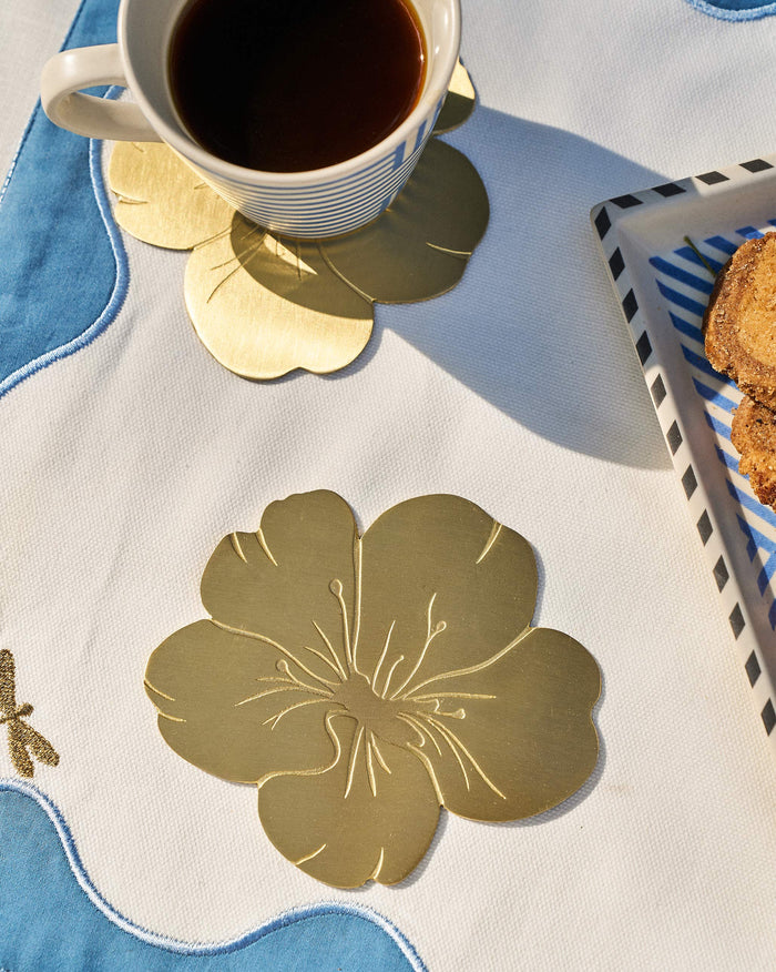 Almond Blossom Coaster laid flat, showing its embossed petals and stamens.