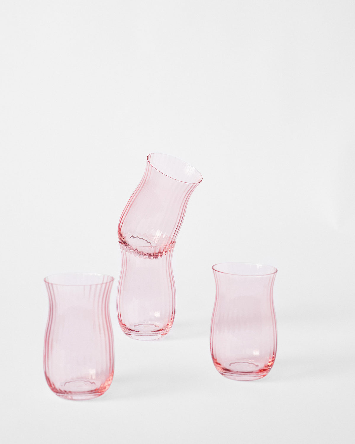 Pink Ripple tumblers standing and nested to show stackability.
