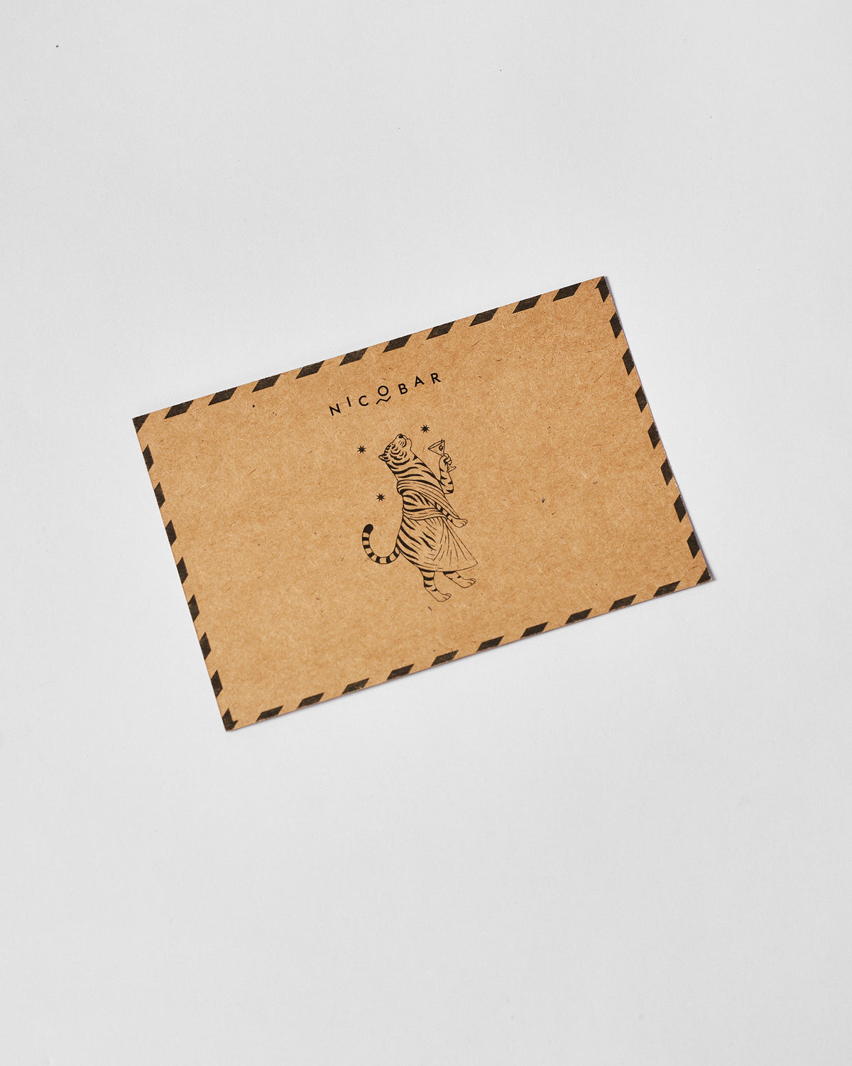Kraft Nicobar gift envelope with a standing tiger illustration.