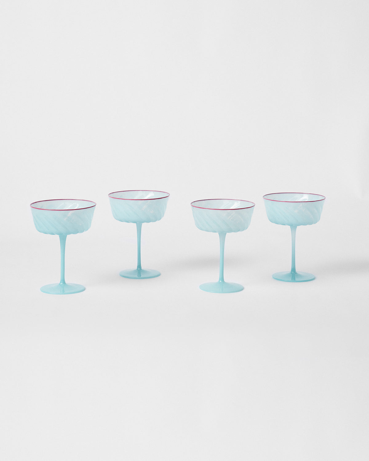 Set of four Ripple Margarita Glasses lined up on a white background.