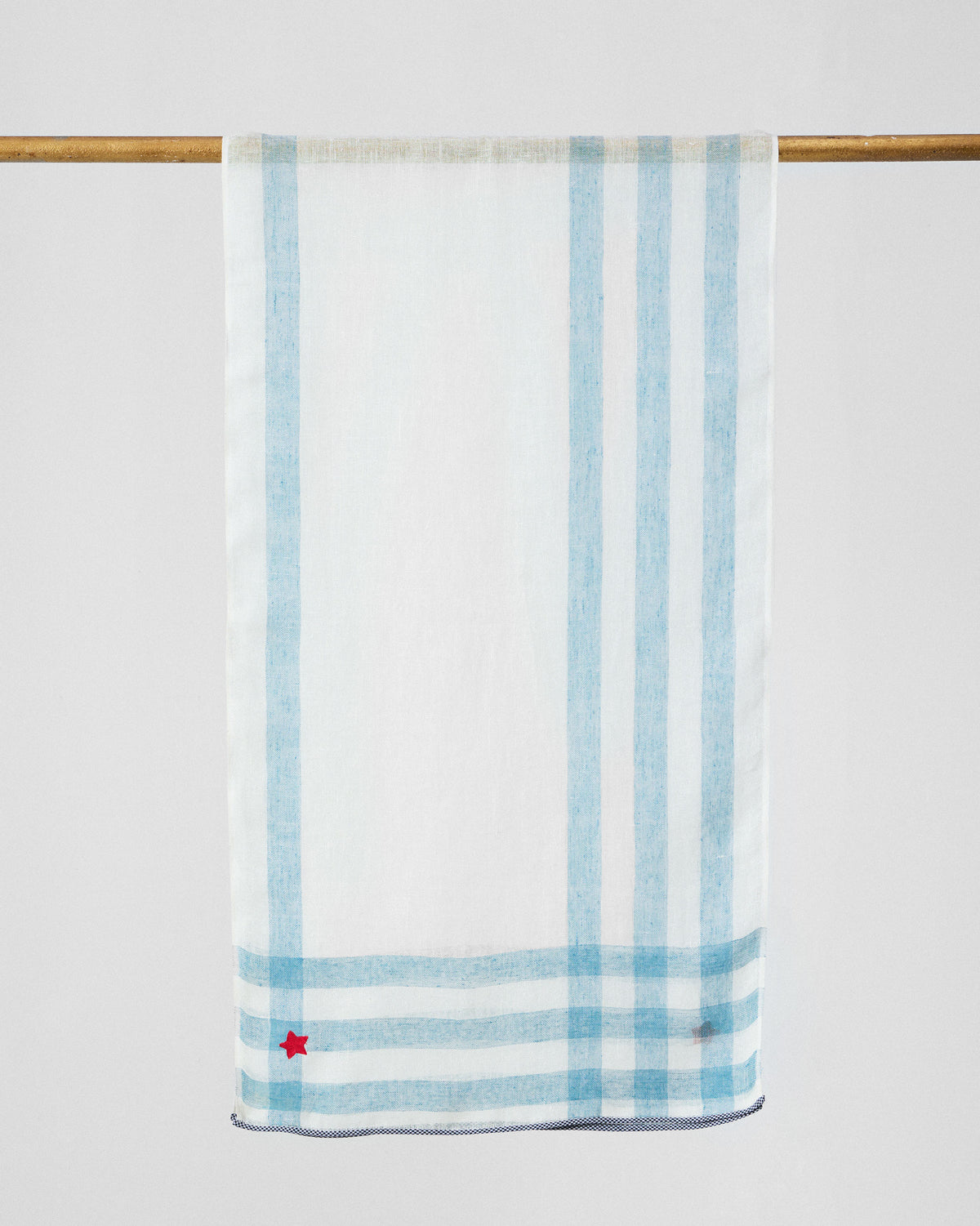 Summer Breeze scarf hung flat, showing pale blue stripes and a red corner star.