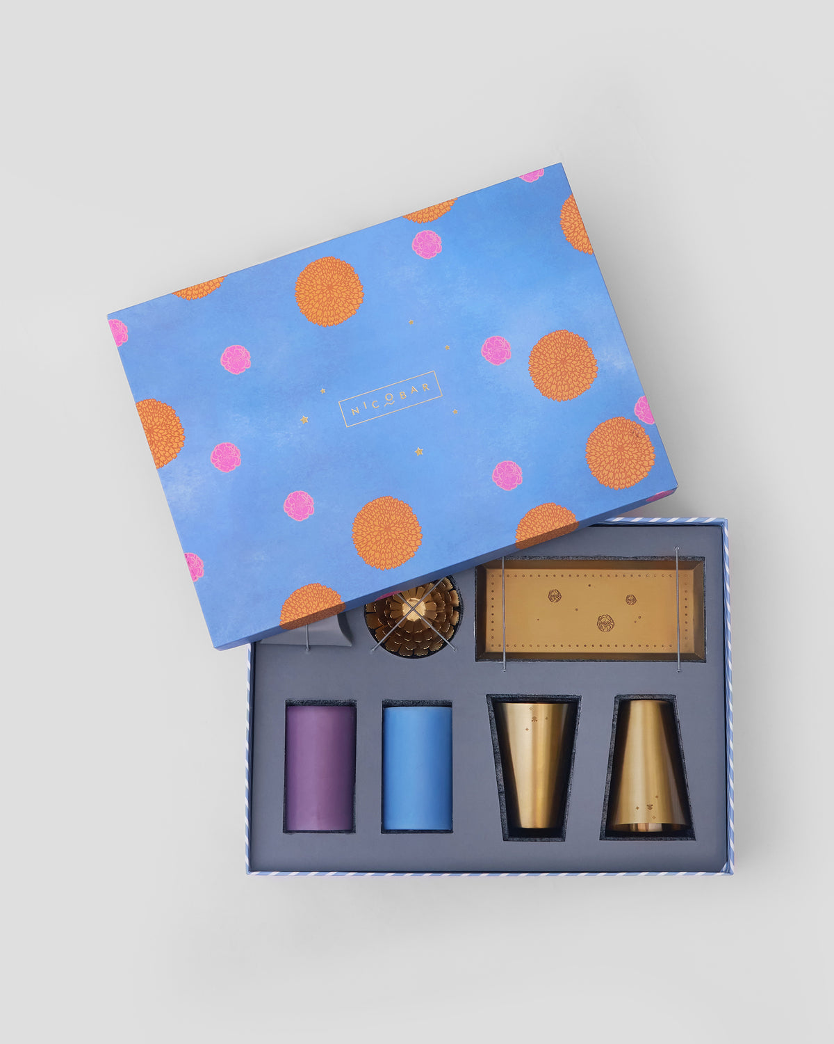 Marigold gift set nestled in an open blue Nicobar box.