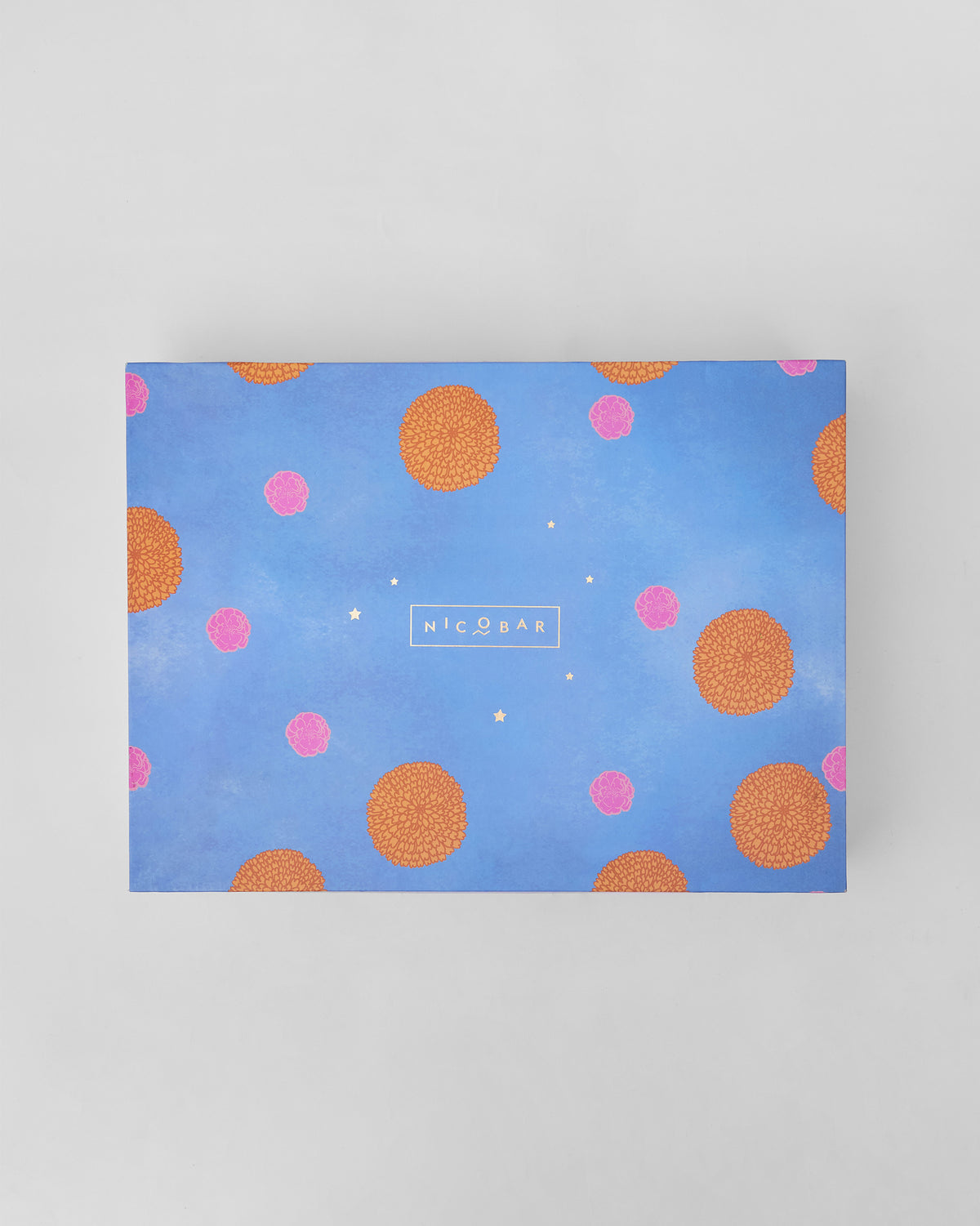 Closed Marigold gift box with orange marigold pattern.