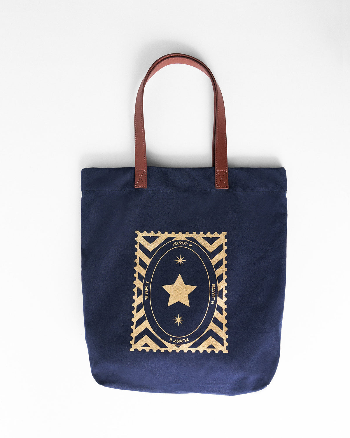 Navy Mukayu City tote with a gold star stamp graphic.