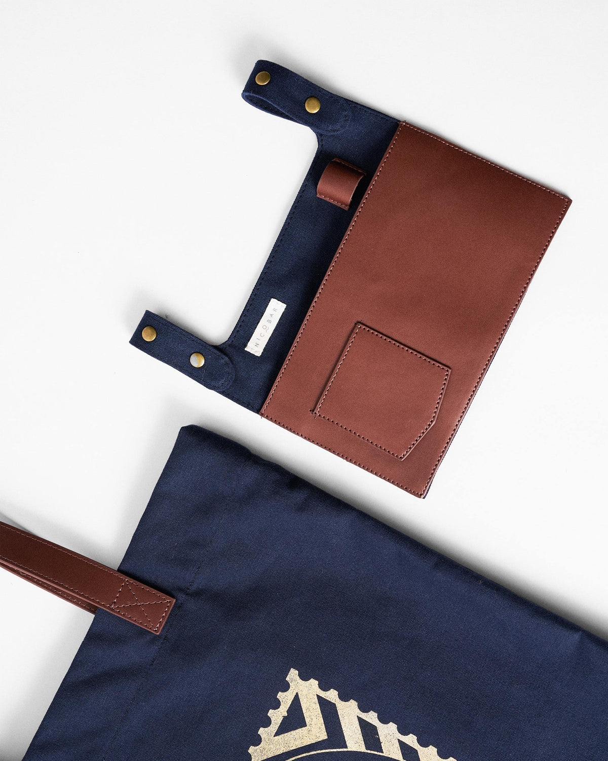 Close-up of the leather organizer pouch for a navy Mukayu City tote.