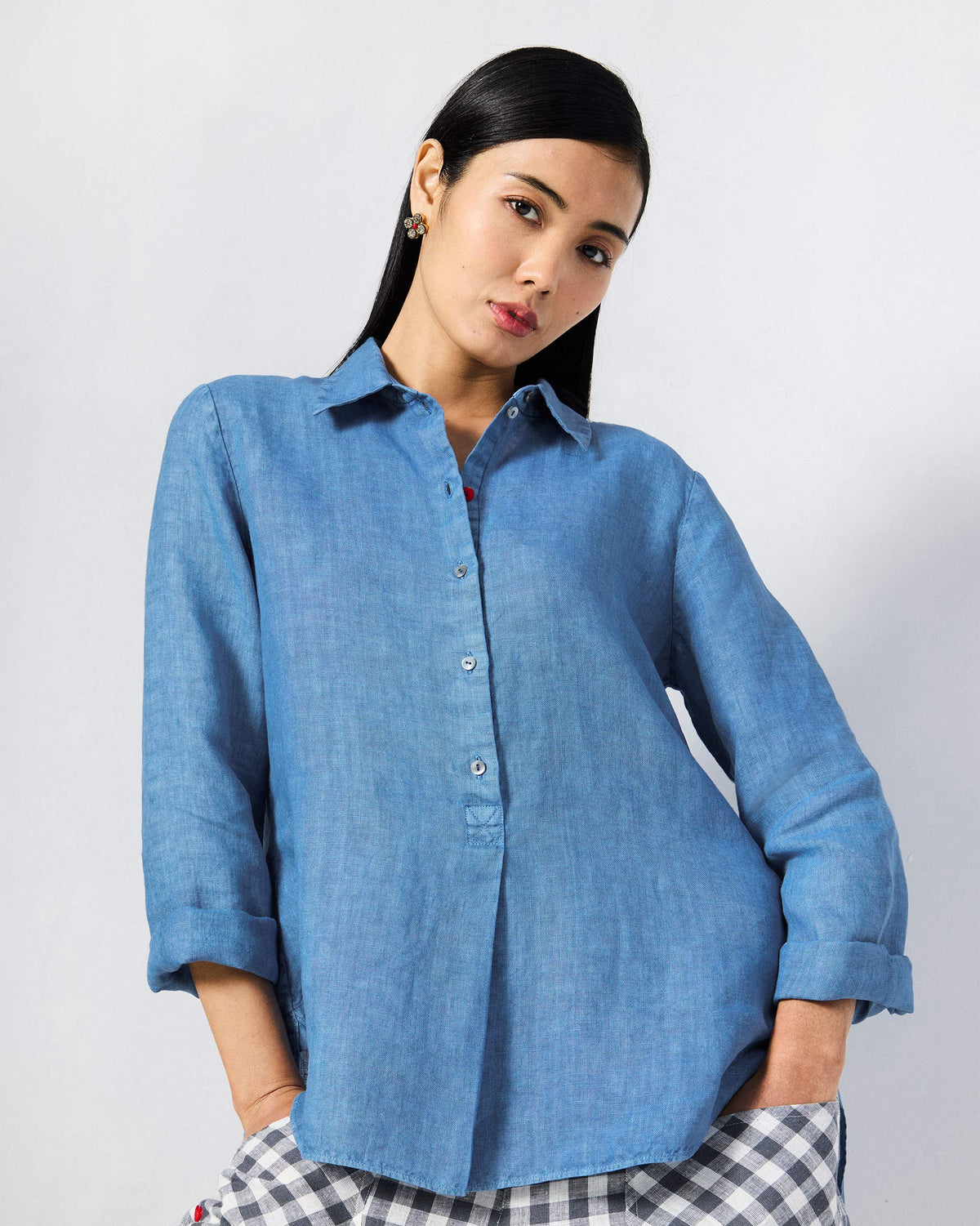 Person wearing a blue Mati shirt.
