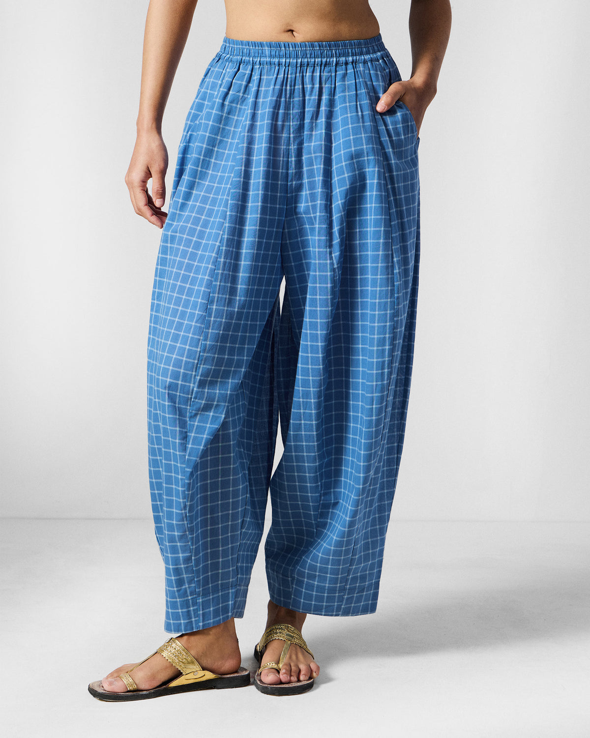 Person wearing riverside blue and white check Tia Pants with a gathered waist.