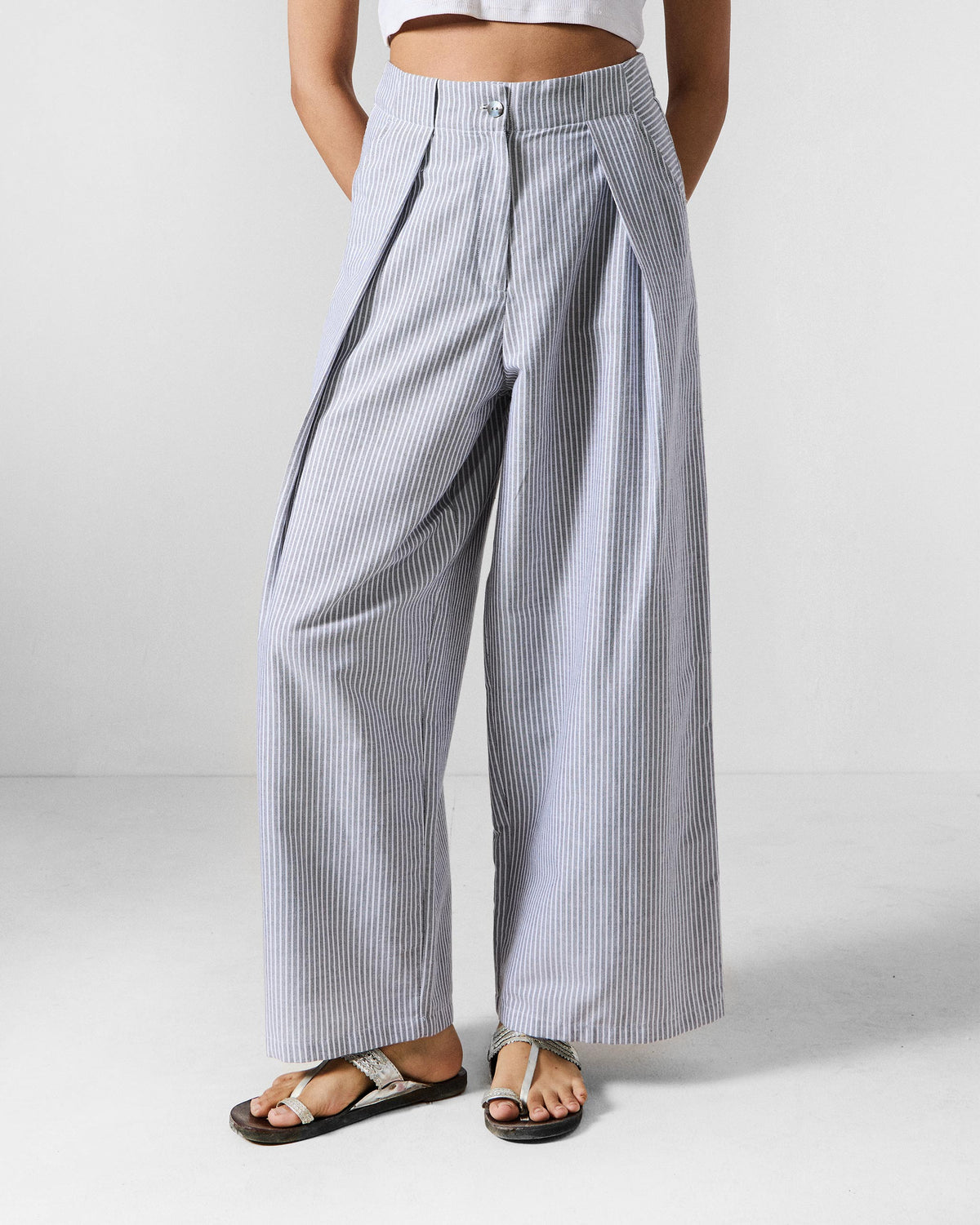 Grey and white striped Costa pants with deep front pleats.