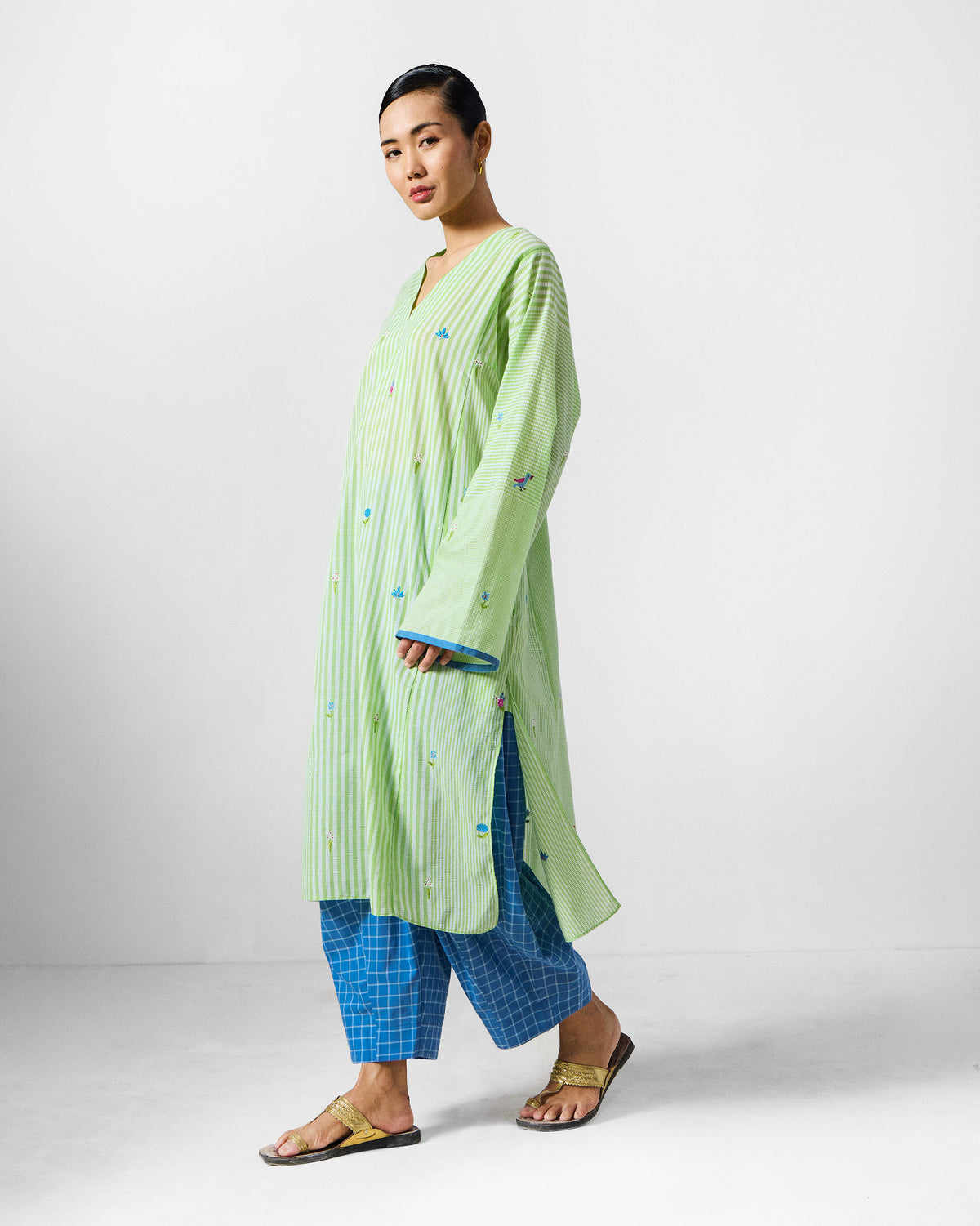 Green and white Gigi Kurta with scattered floral embroidery.