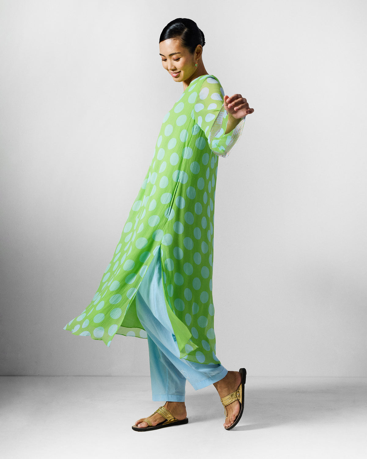 Side view of a green and blue dotted Pleated Bell Sleeve kurta.