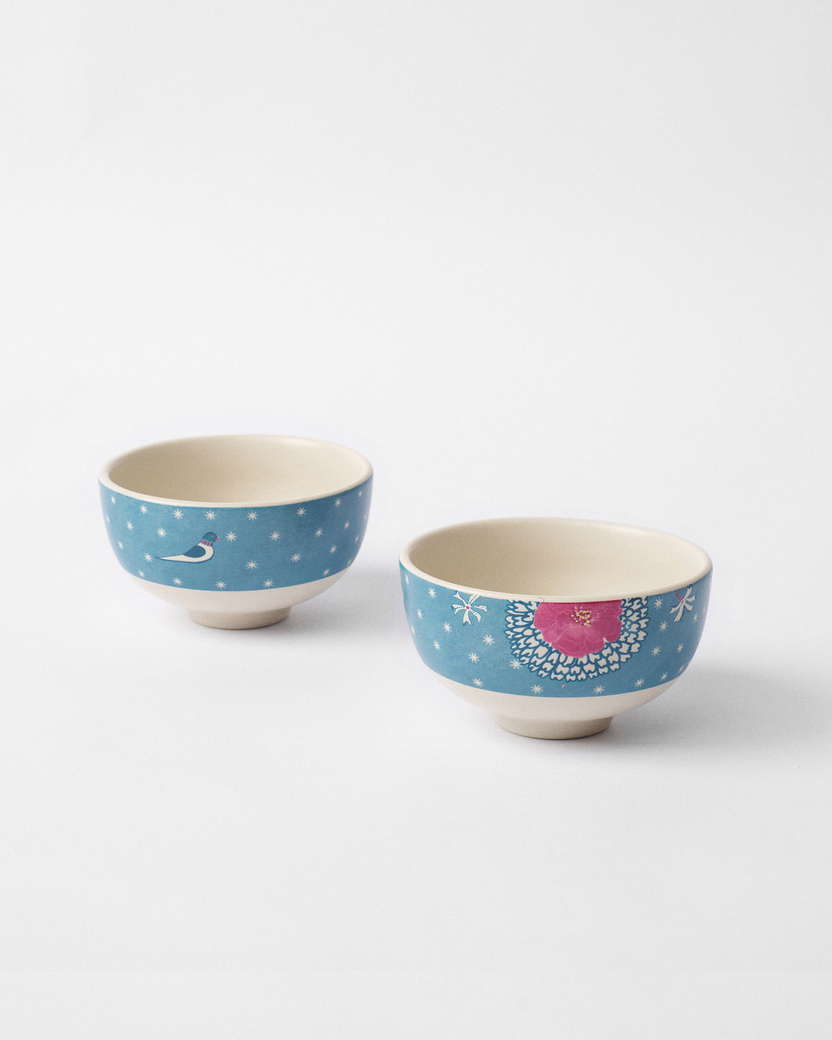 Pair of Marigold nibble bowls with bird and pink flower motifs.