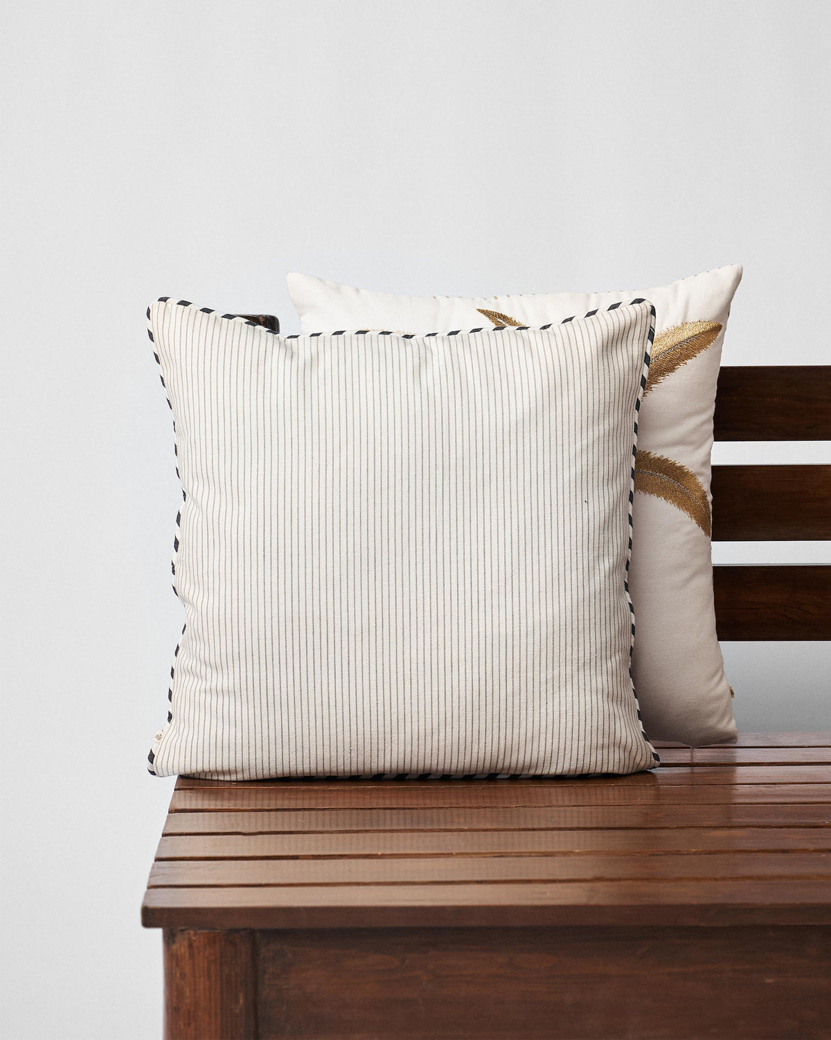 Back of the Stag Cushion Cover in cream striped fabric.