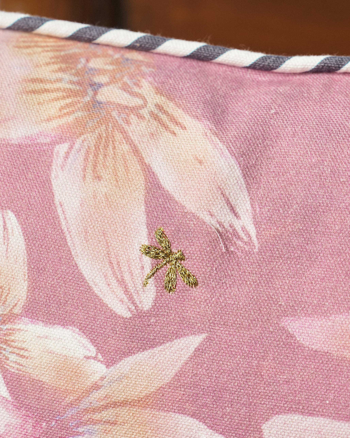 Close-up of the Stag Cushion Cover showing a small gold embroidered dragonfly.