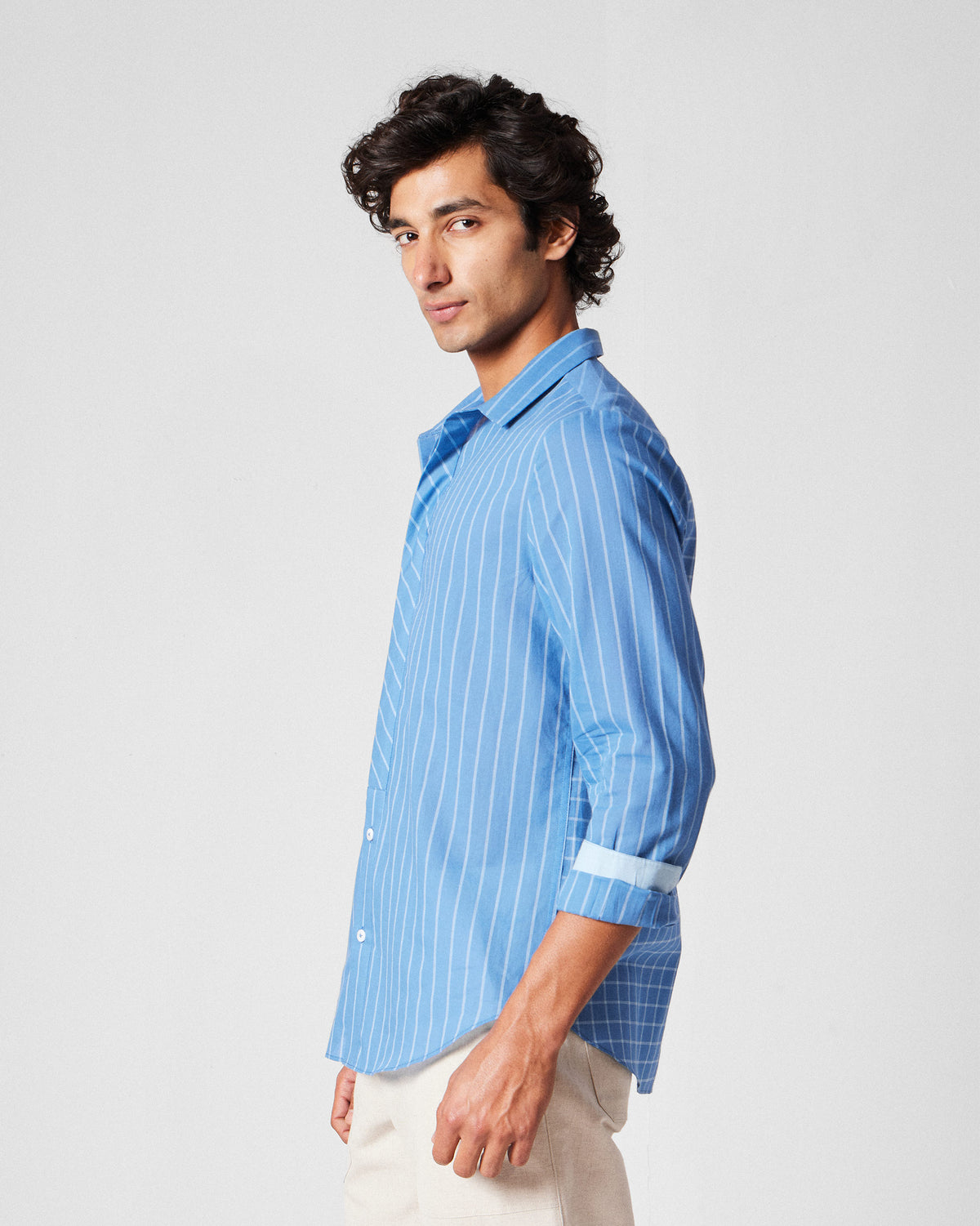 Side view of a riverside blue Bias Placket shirt showing stripe and check panels.