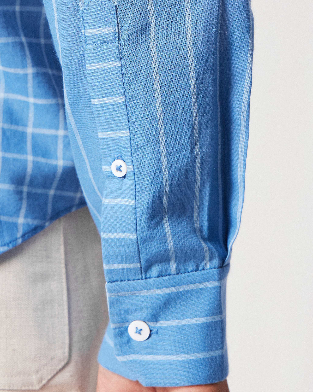 Close-up of a riverside blue Bias Placket shirt cuff with contrasting stripe direction.