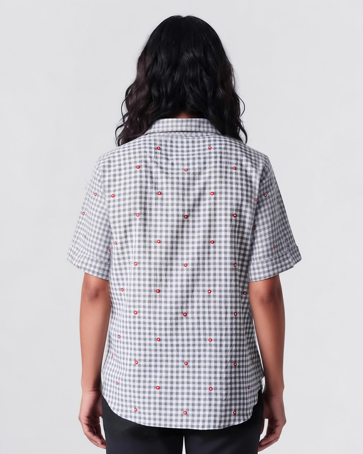 Back of a charcoal and ivory Mistari shirt with red embroidered dots.
