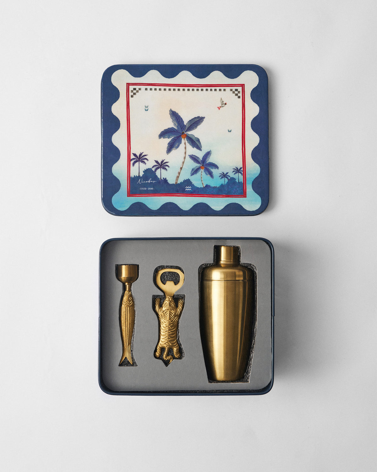 Open Kandy Stripes Barware Gift Set tin with gold shaker, muddler and opener.