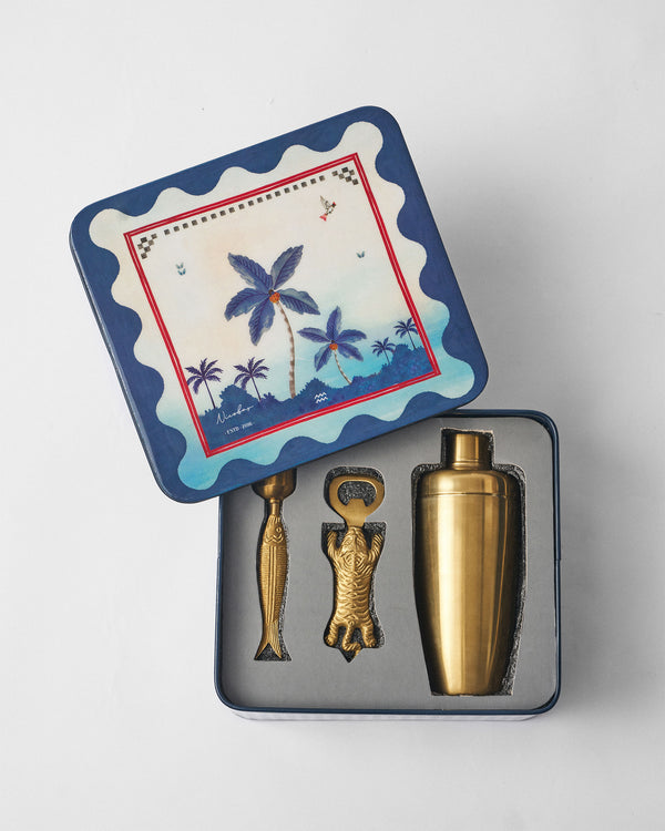 The open tin with the three gold tools