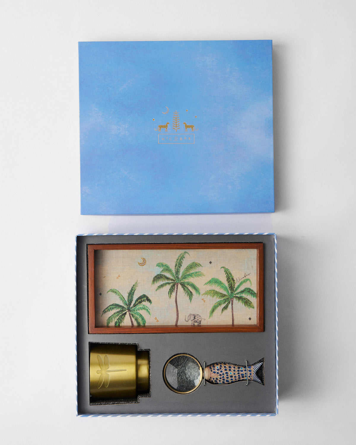 Open Explorer gift set with tray, gold planter, and fish magnifier.