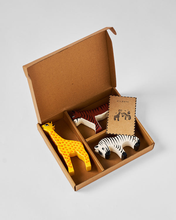 The open box with the animals and a small card