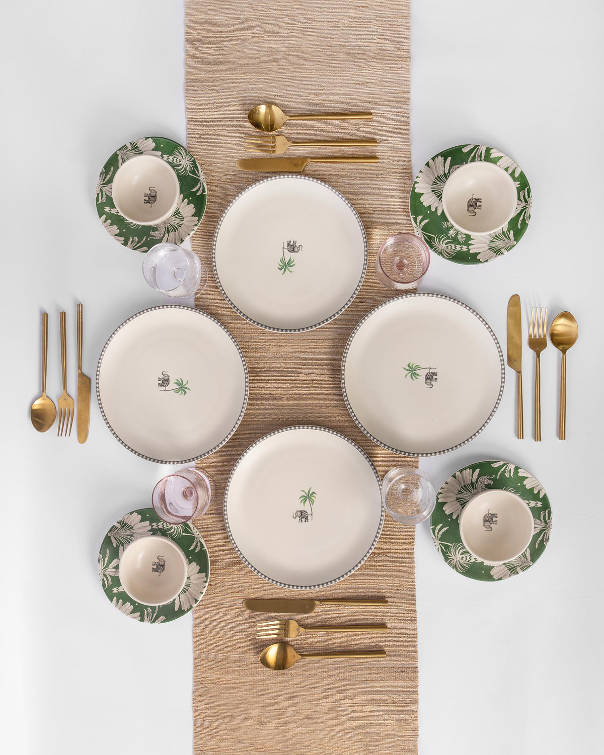 Haathi Quarter Plate among matching plates and bowls laid out on a table.