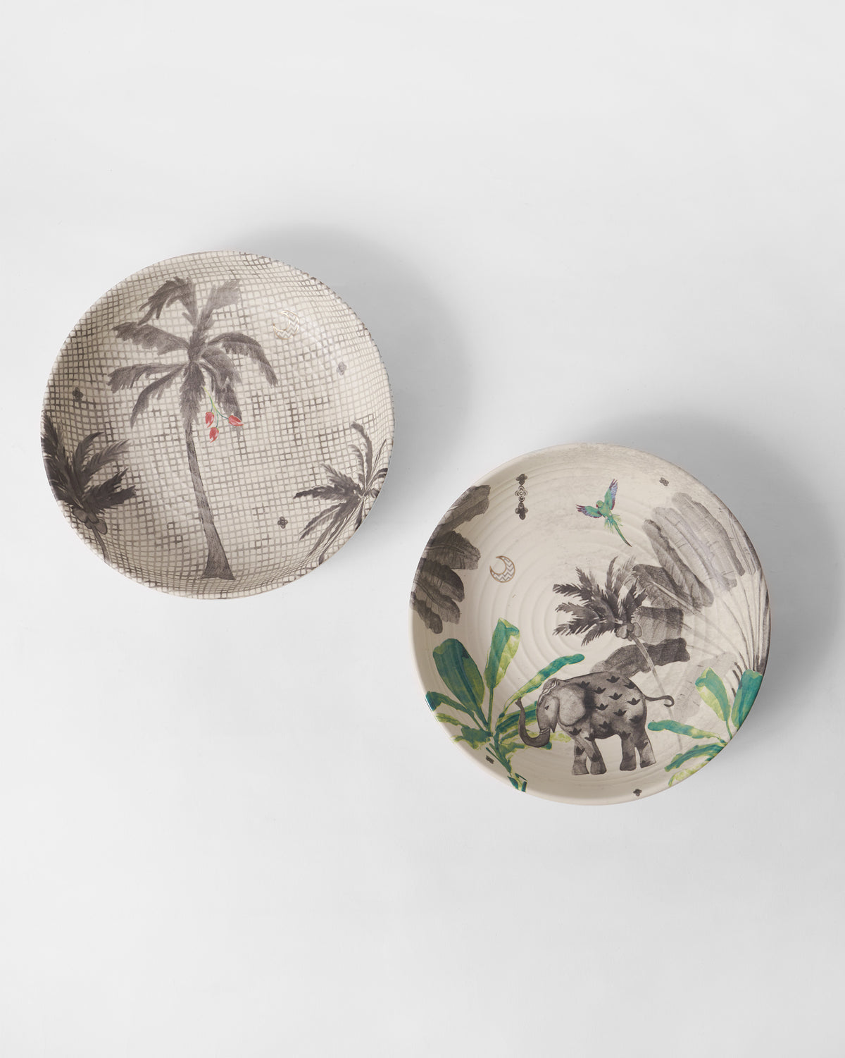 Haathi shallow bowls showing a checkered palm print and an elephant among leaves.