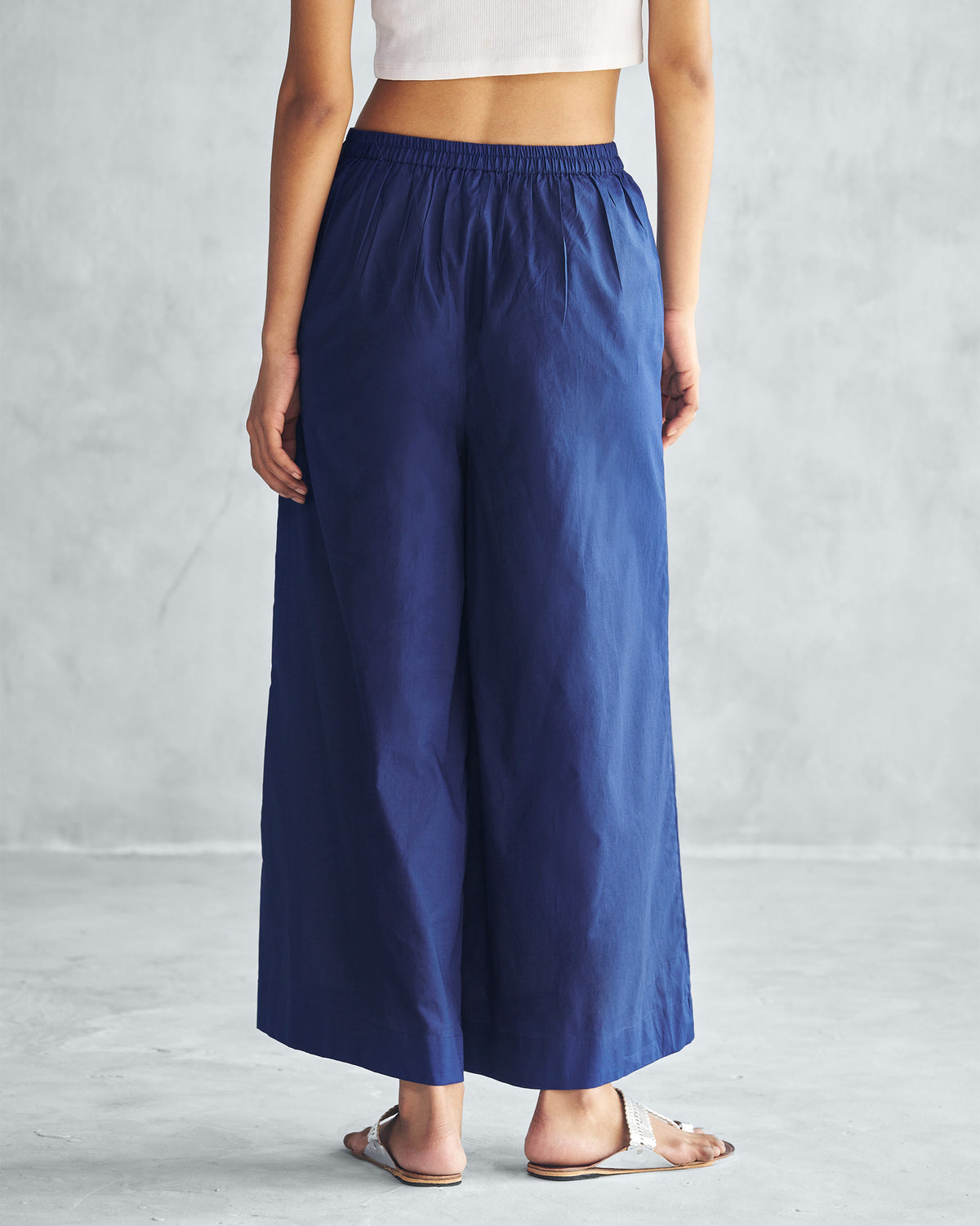 Back of ink blue Basic Pyjamas worn by a person.