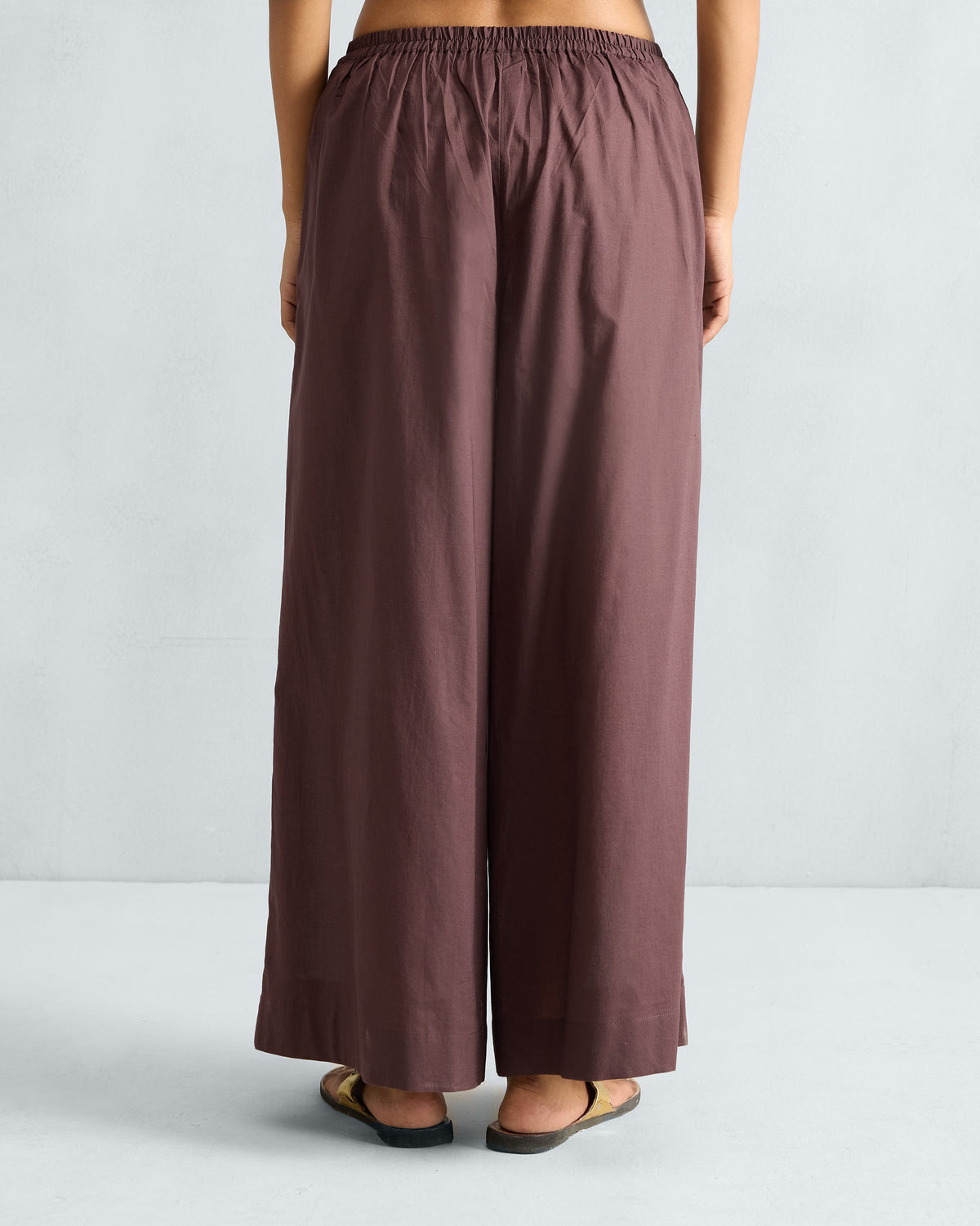 Back of chocolate plum Basic pyjamas with an elastic gathered waist.