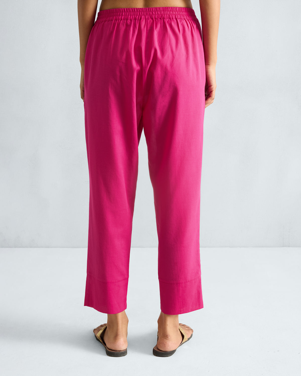 Back of fuchsia Narrow Pants with an elastic waistband.