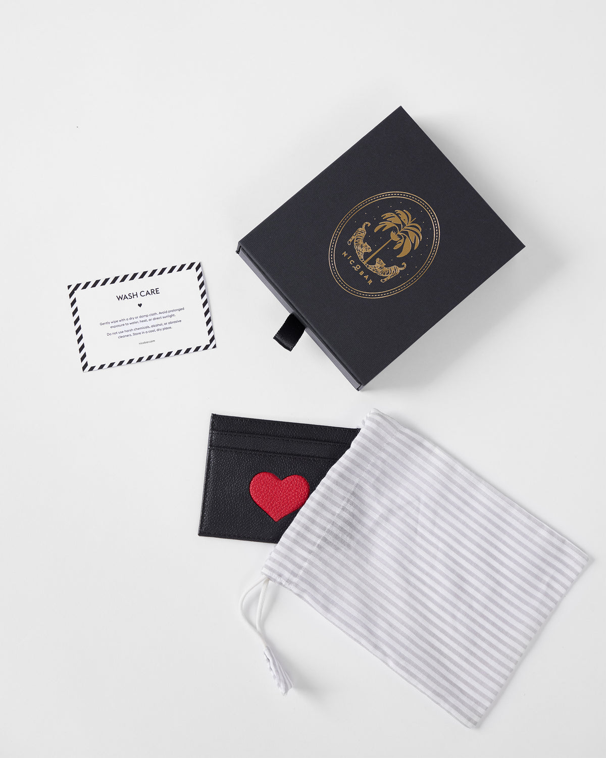 Black Everyday Heart Card Holder with a red heart beside its pouch and gift box.