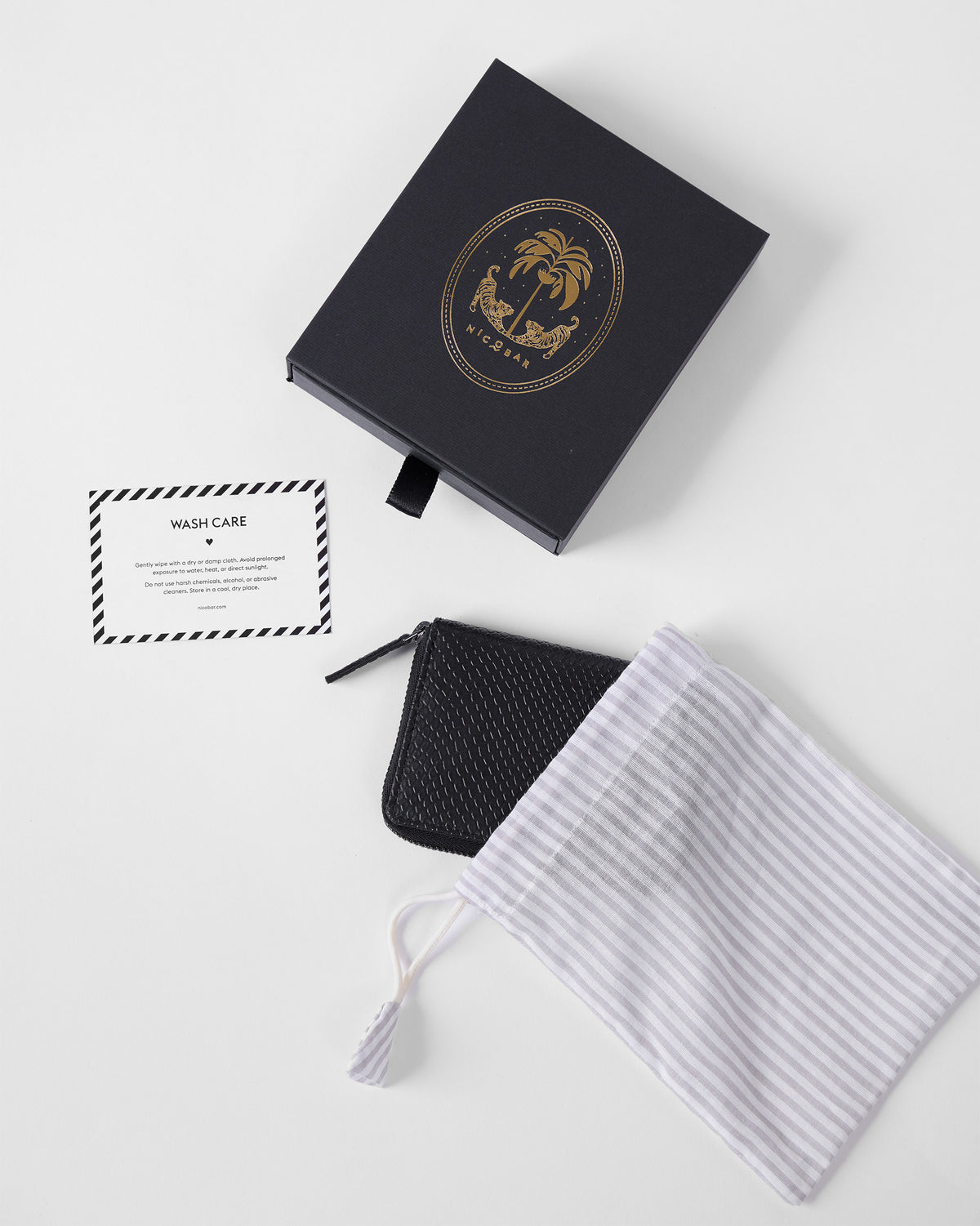 Black All Rounder Wallet with gift box, dust bag, and care card.