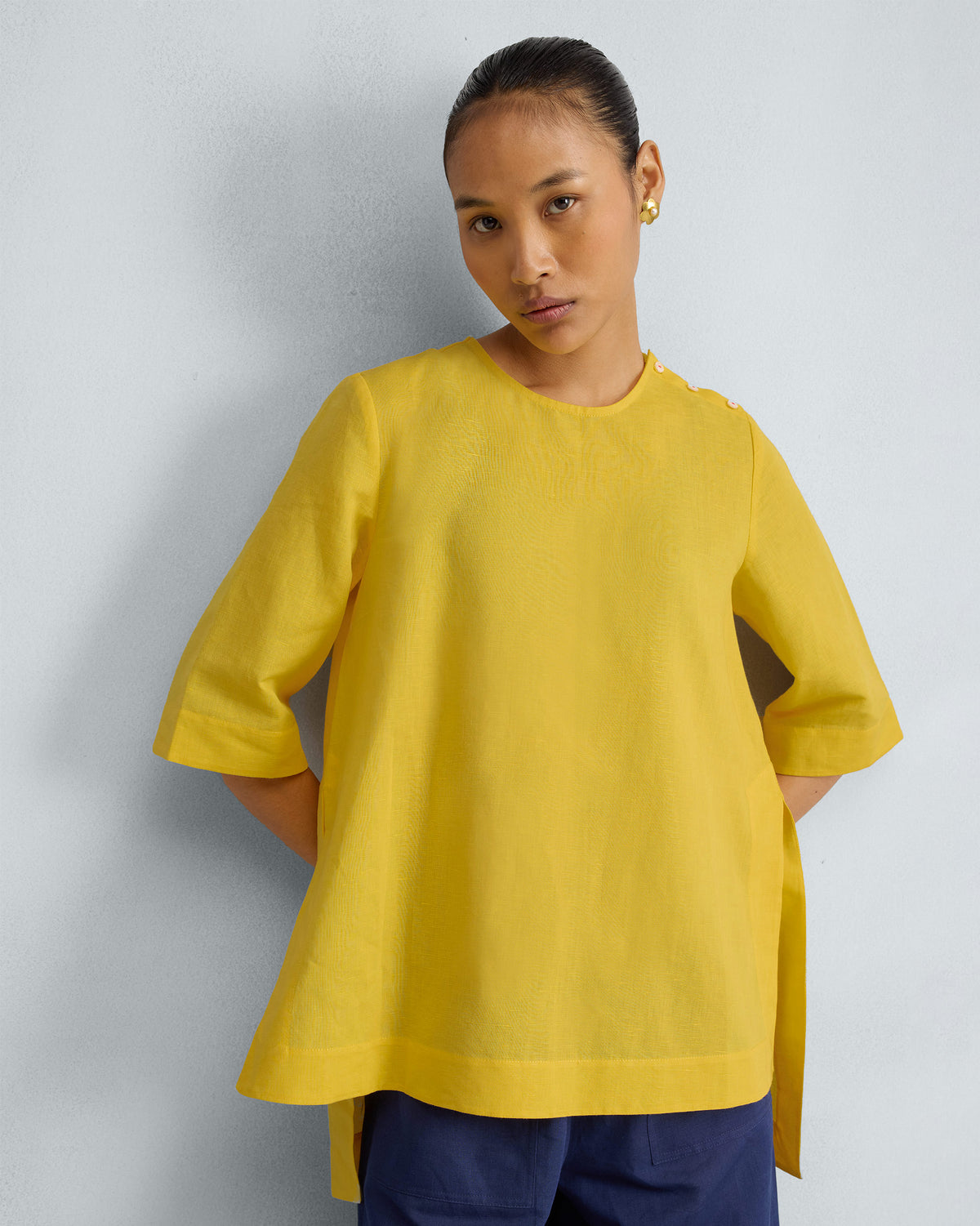 Yellow High Slit Top with a round neck, wide sleeves, and side slits.