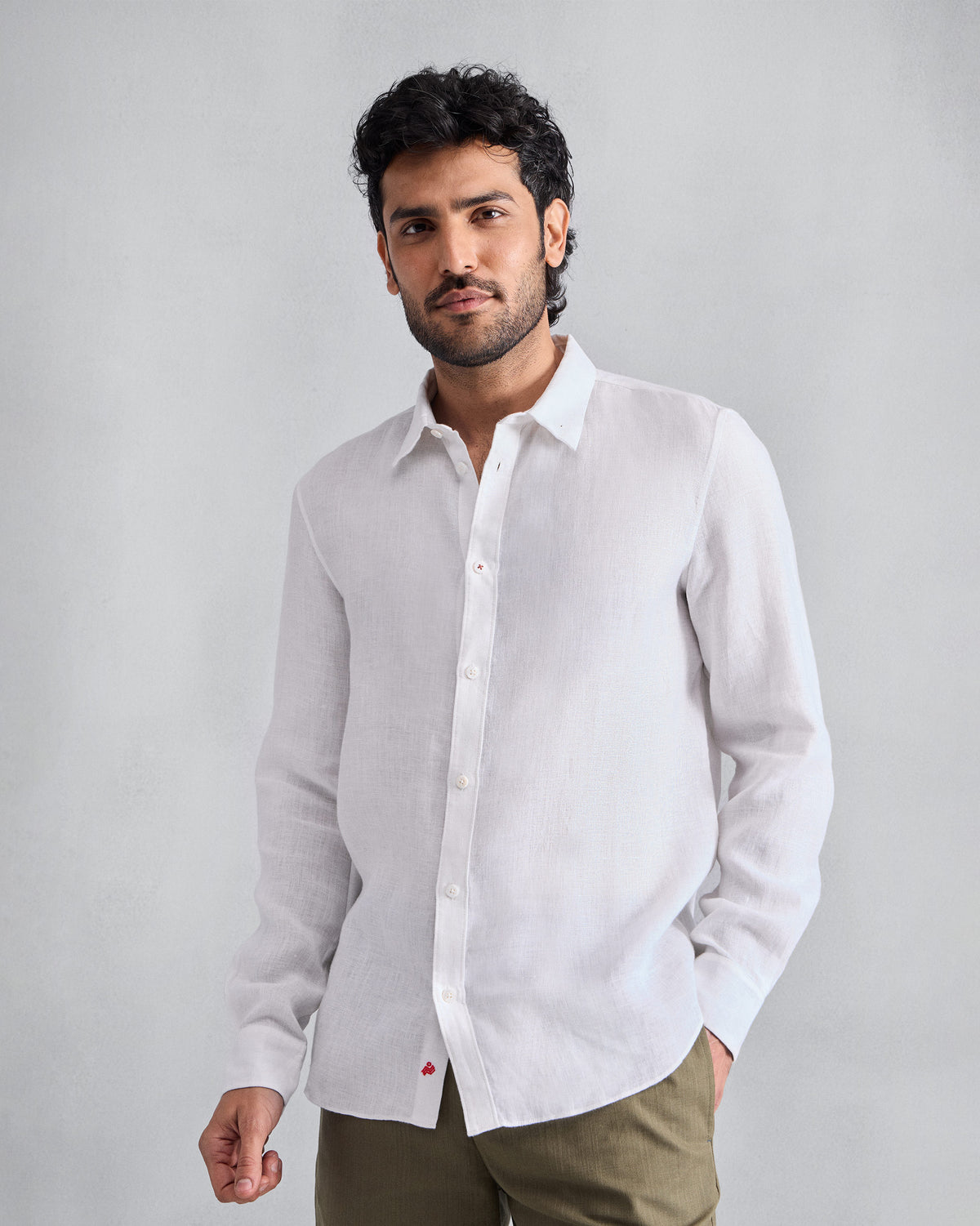 Person wearing a white Classic shirt.
