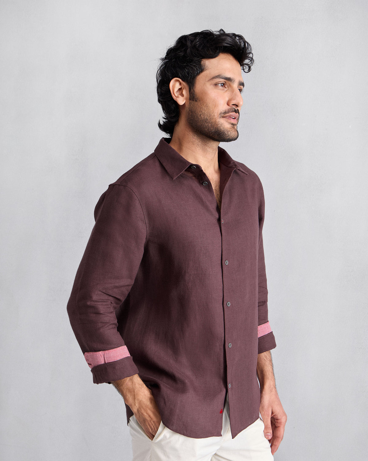 Person wearing a chocolate plum Classic shirt with contrast cuff lining.