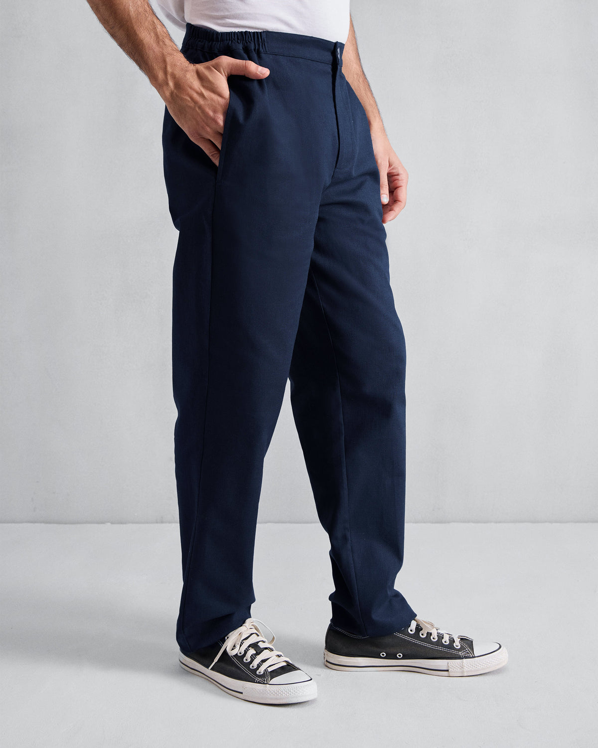 Side view of orian blue Meadow Pants with a relaxed straight leg.