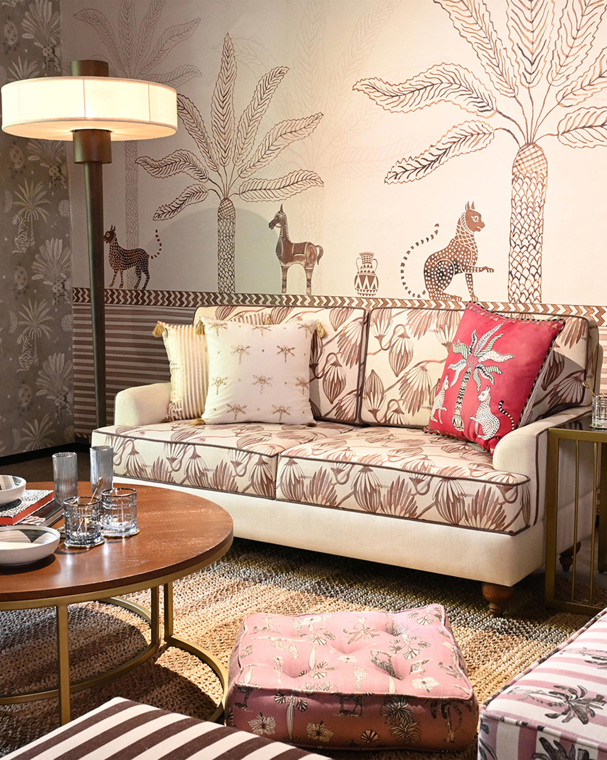 Field Sofa with botanical print styled in a living room with patterned pillows.