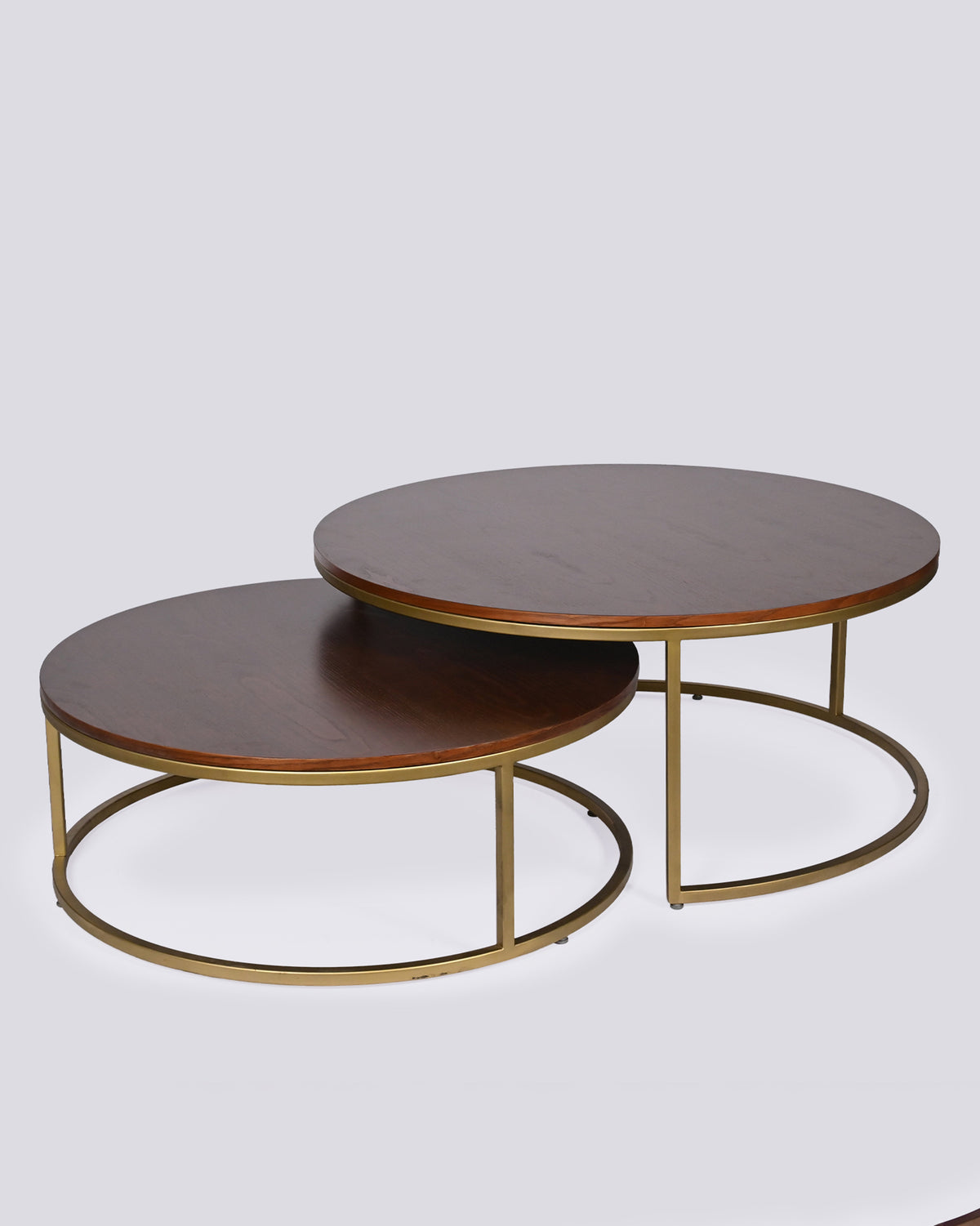 High angle of Orbit nesting tables showing round wood tops and brass bases.