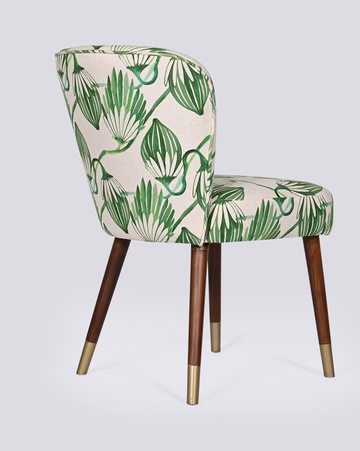 Three-quarter back view of the Breeze Dining Chair in green blooms print.