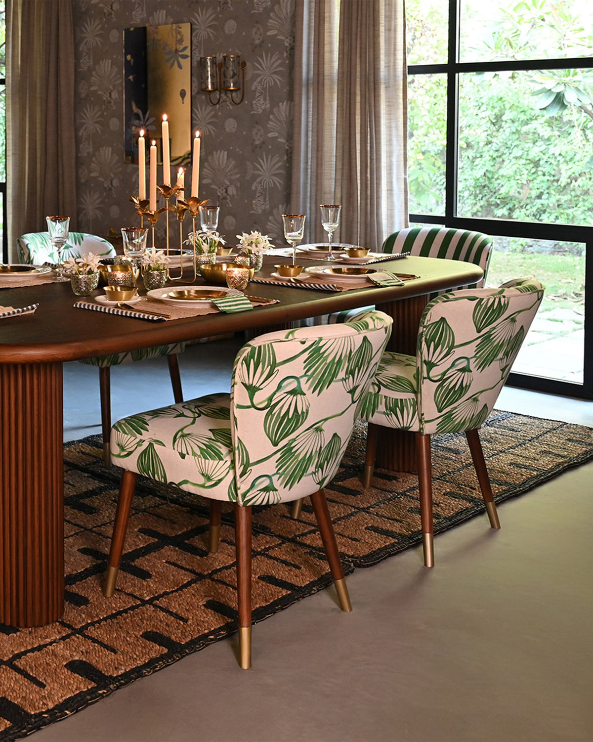 Breeze Dining Chairs in green blooms print around a set dining table.