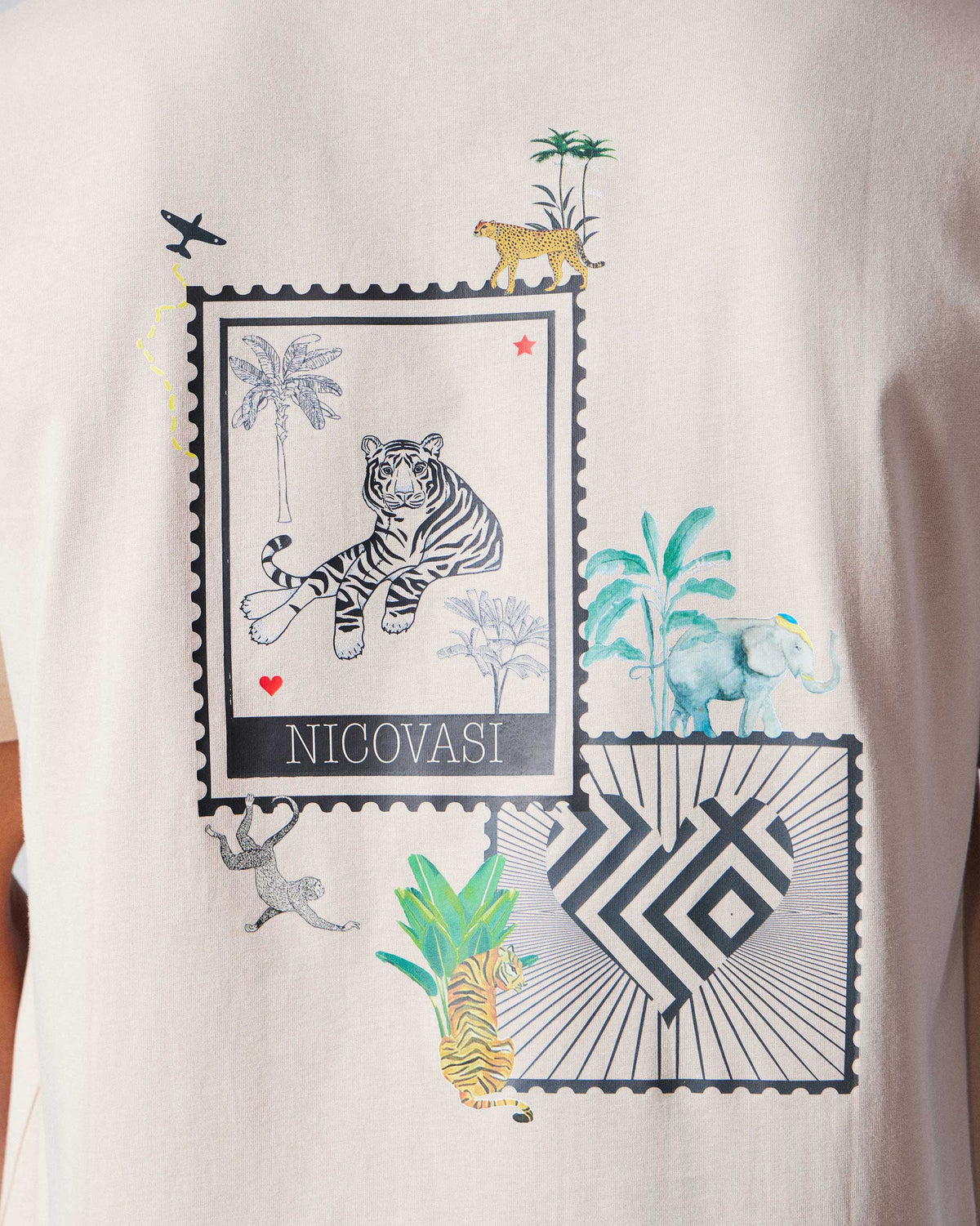 Close-up of the Postal T-Shirt back print with tiger and animal stamps.