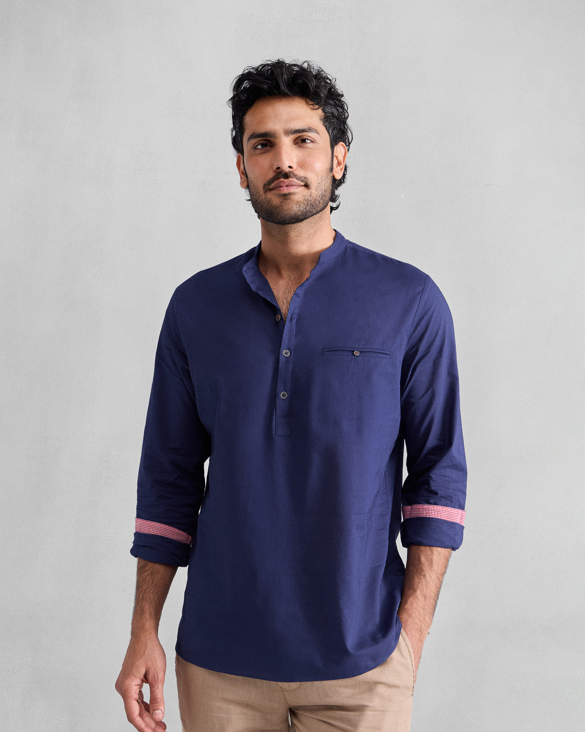 Person wearing an ink blue Pondicherry Shirt with a chest welt pocket.