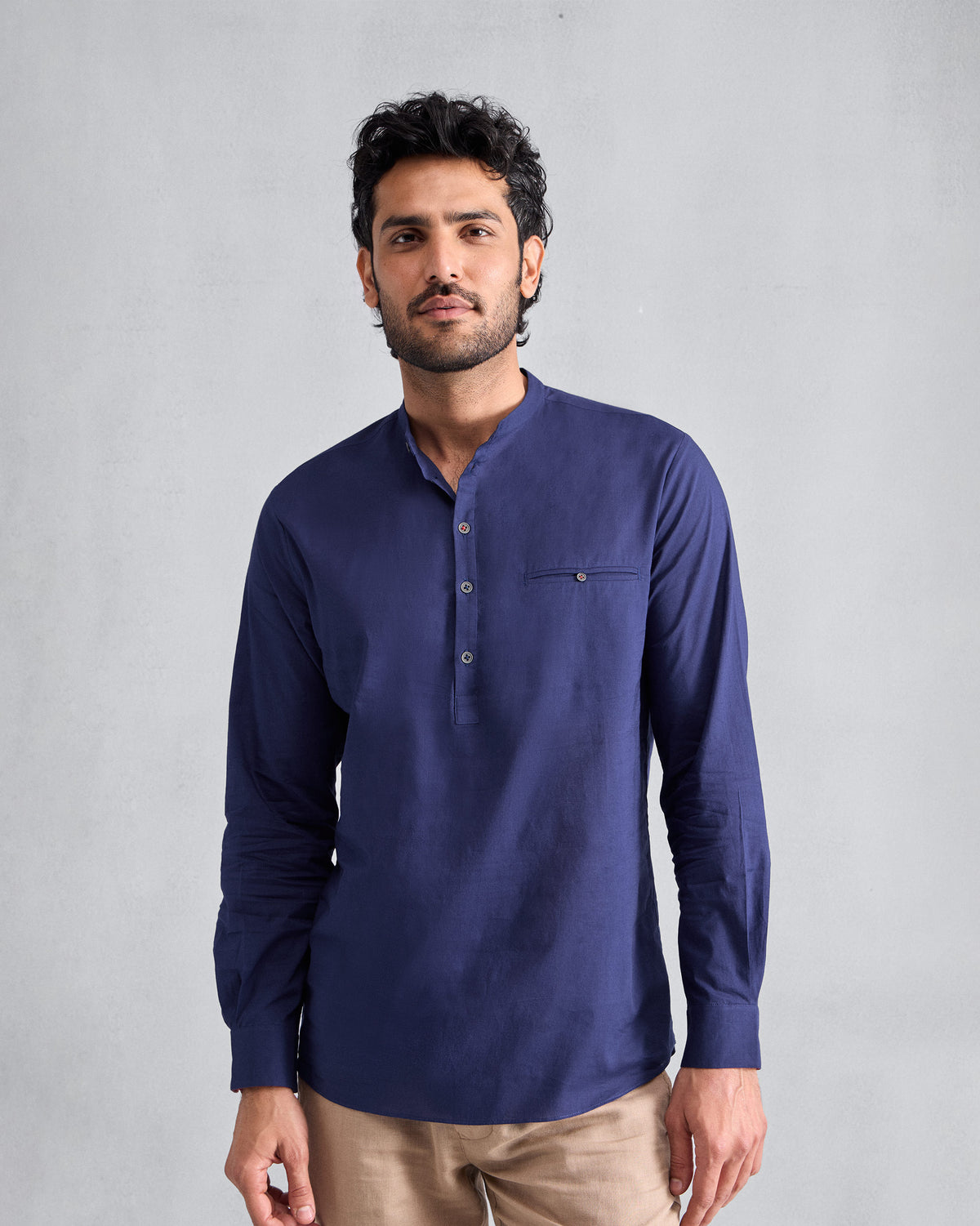 Person wearing an ink blue Pondicherry Shirt with full sleeves and a chest welt pocket.