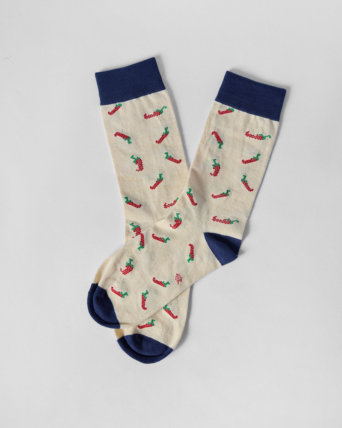 Pair of Chilli Pop socks laid at an angle, showing the navy heel and toe.