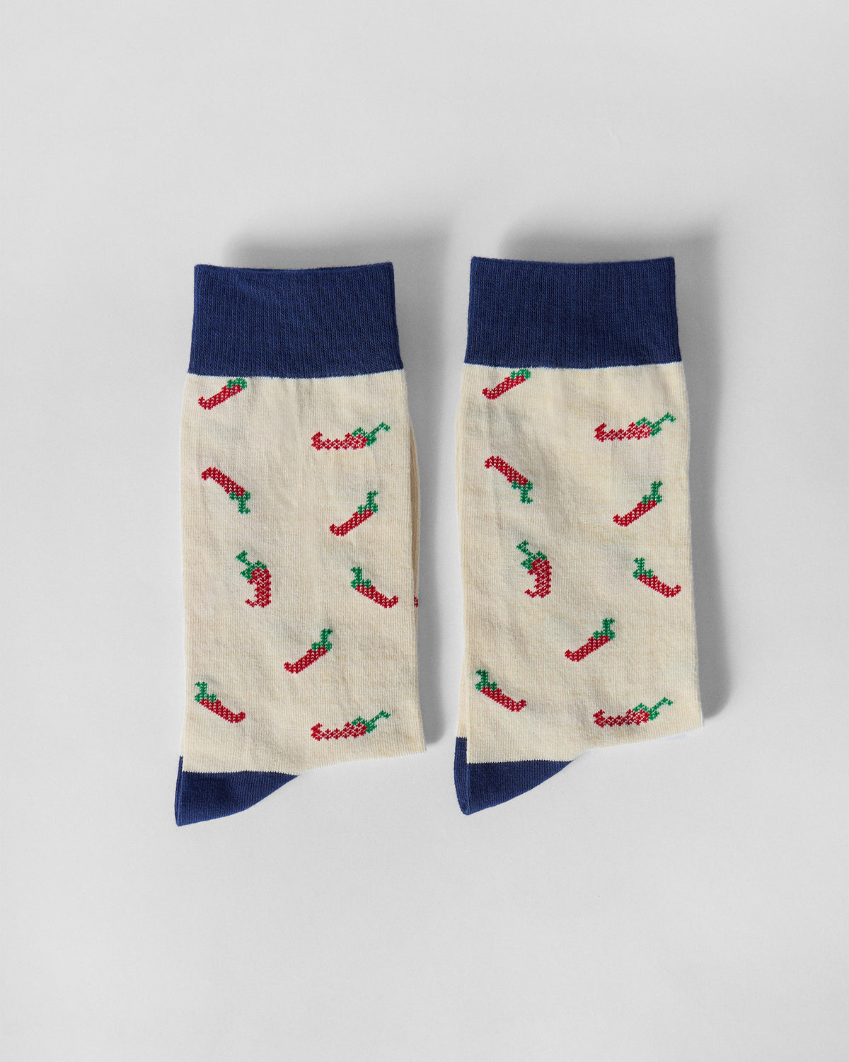 Pair of Chilli Pop socks side by side, showing the chilli print on each leg.