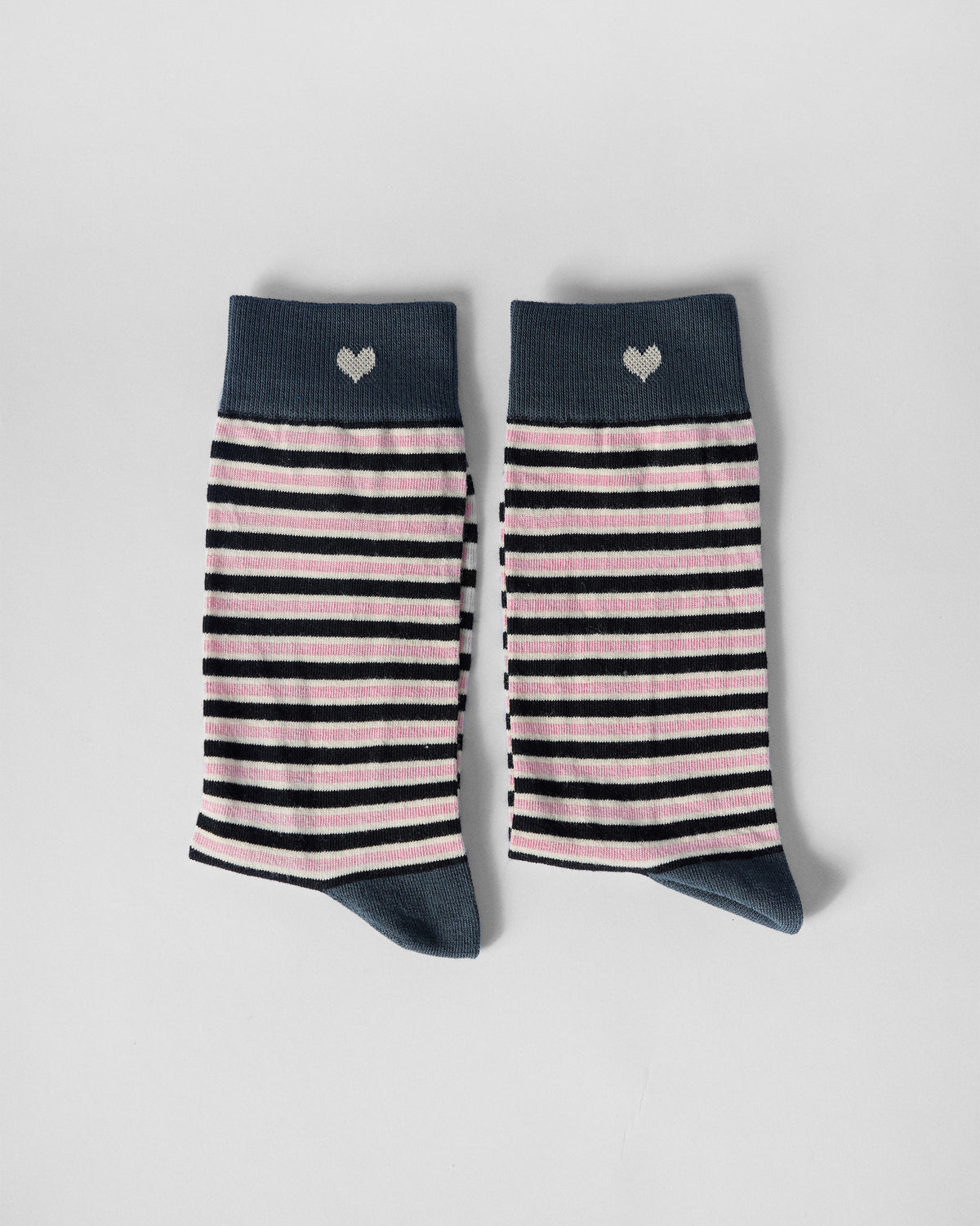 Pair of Candy Stripe socks side by side, showing the heart on each cuff.