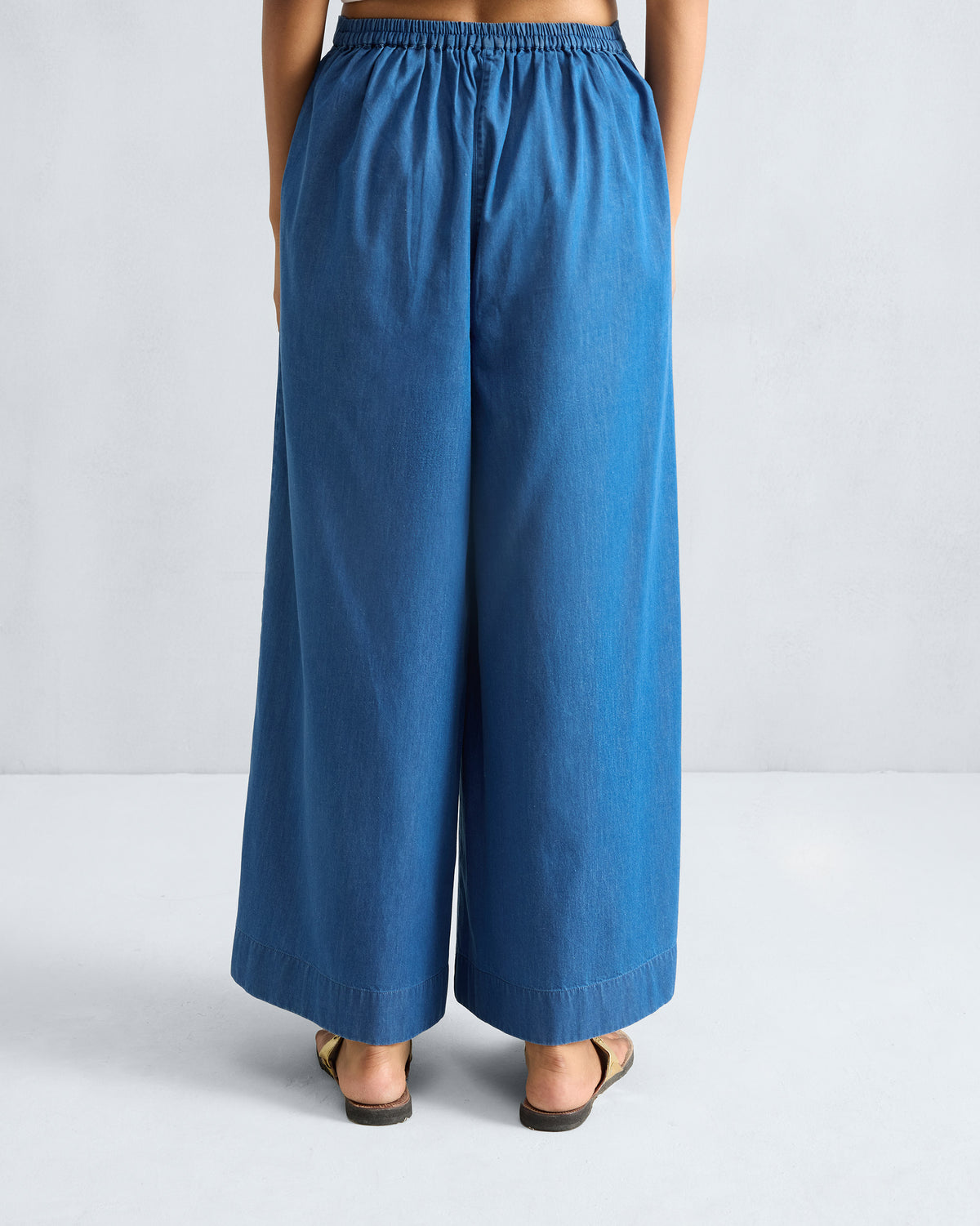 Back of denim blue Basic pyjamas with an elastic gathered waist.