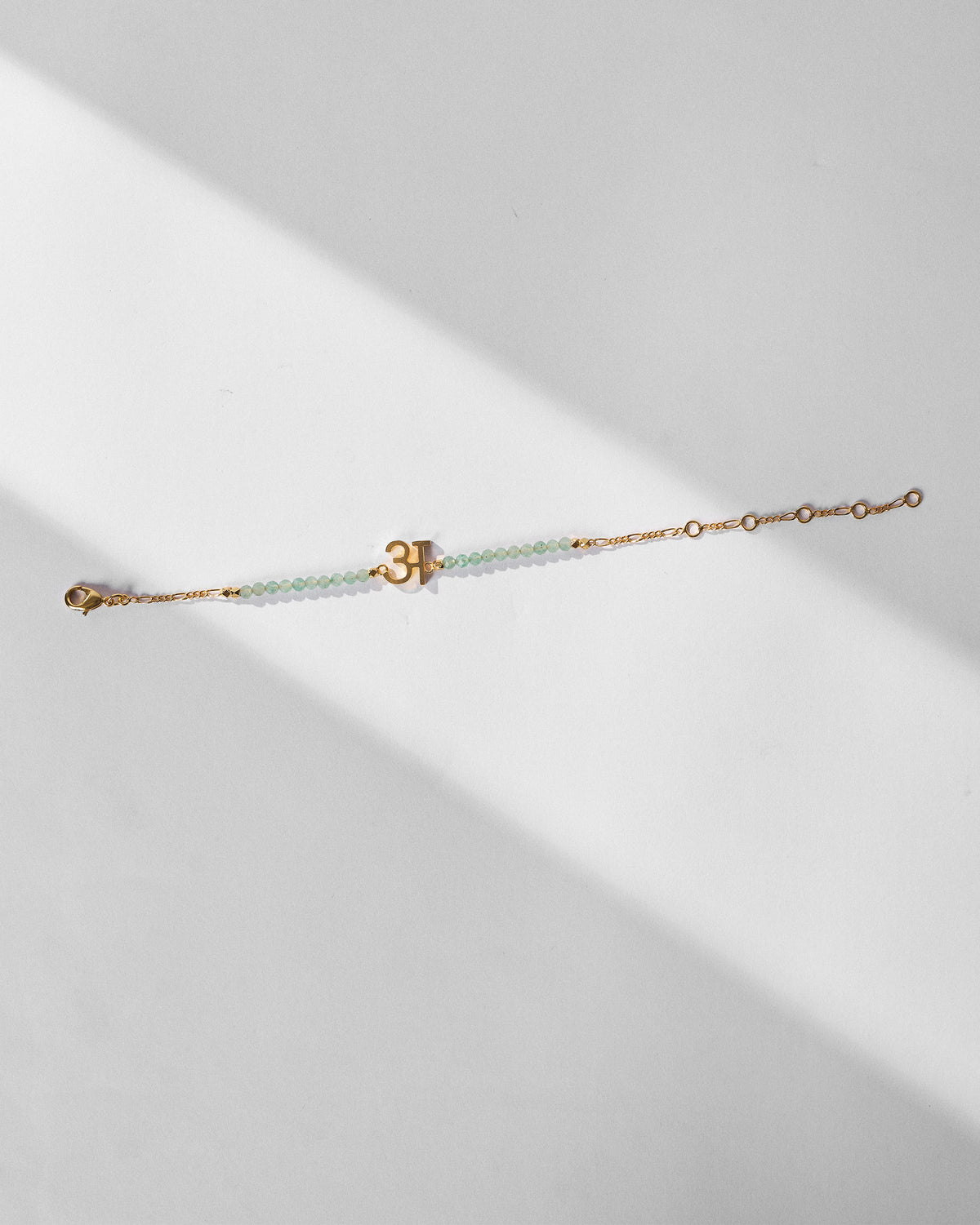 Akshar Bracelet (A) - Gold stretched out, showing its extension chain.